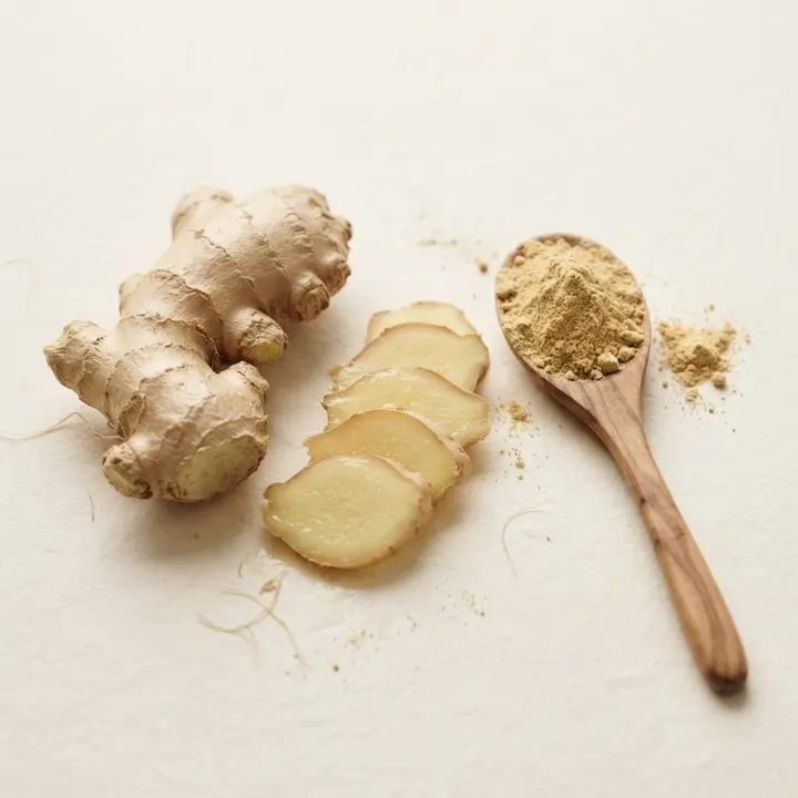 Fresh ginger root on a wooden surface